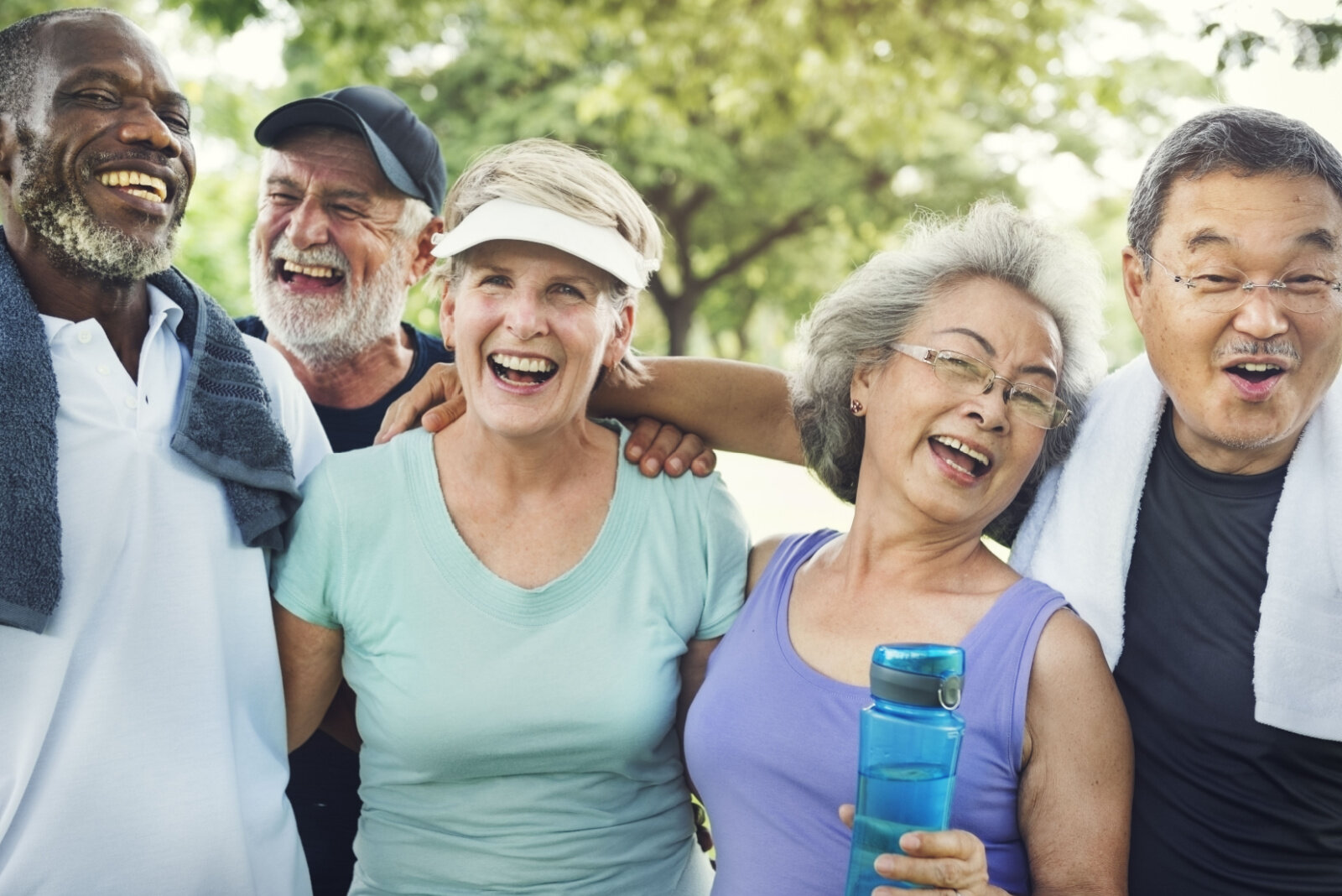 A group of active seniors in sportswear are looking happy and jolly after exercising.